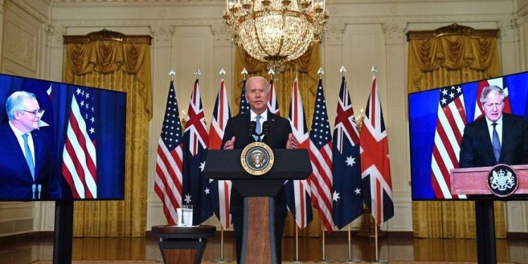 Australia will pay the French Naval Group $835 million compensation for a cancelled submarine contract