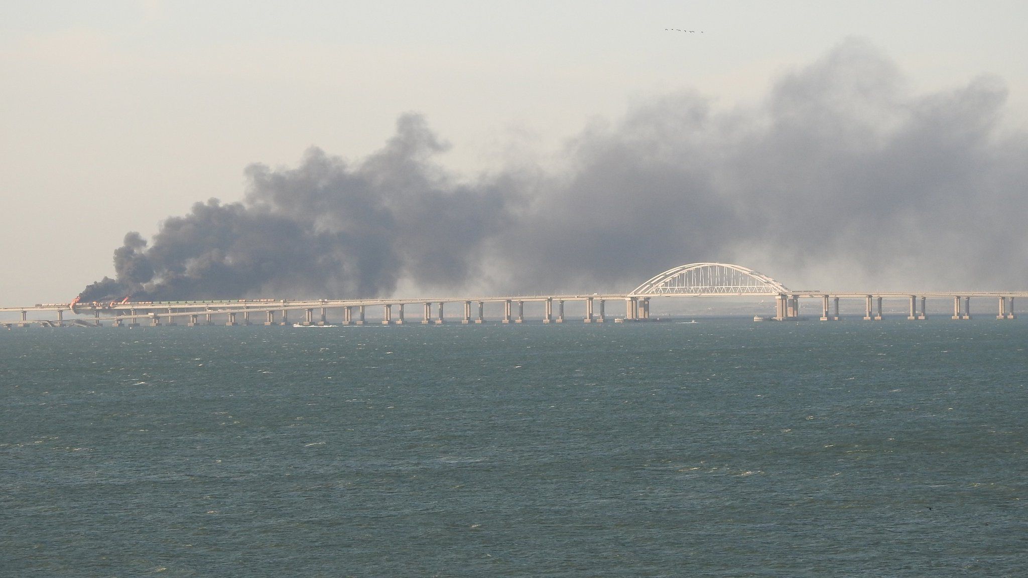 Explosions damaged Russia’s key bridge linking Crimea